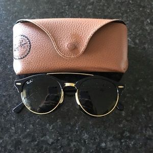 Black and gold Ray-Ban sunnies
